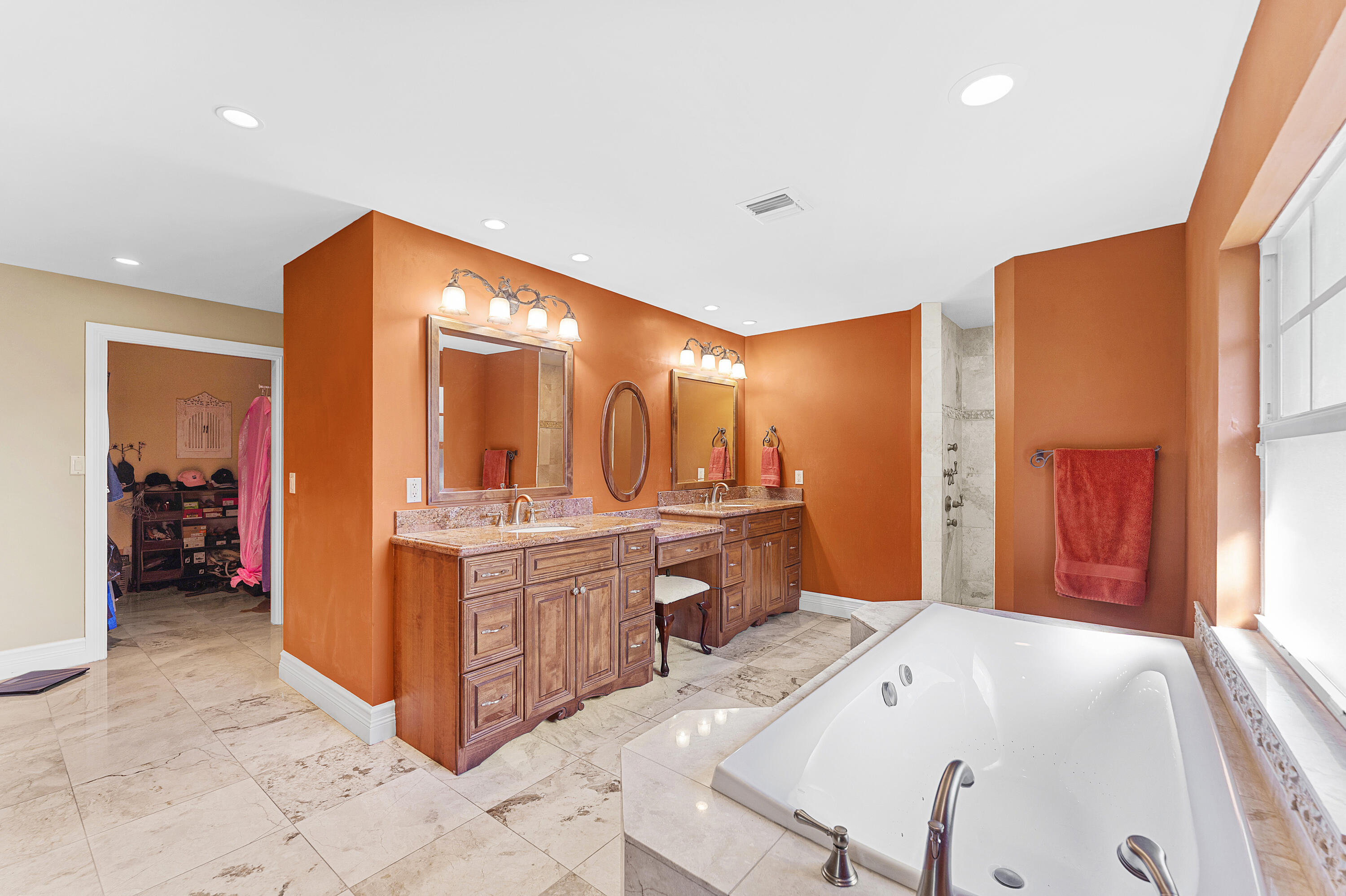 10295 St Andrews Road Boynton Beach, FL 33436 - Photo 20 of 43 a large bathroom with a large tub and sink