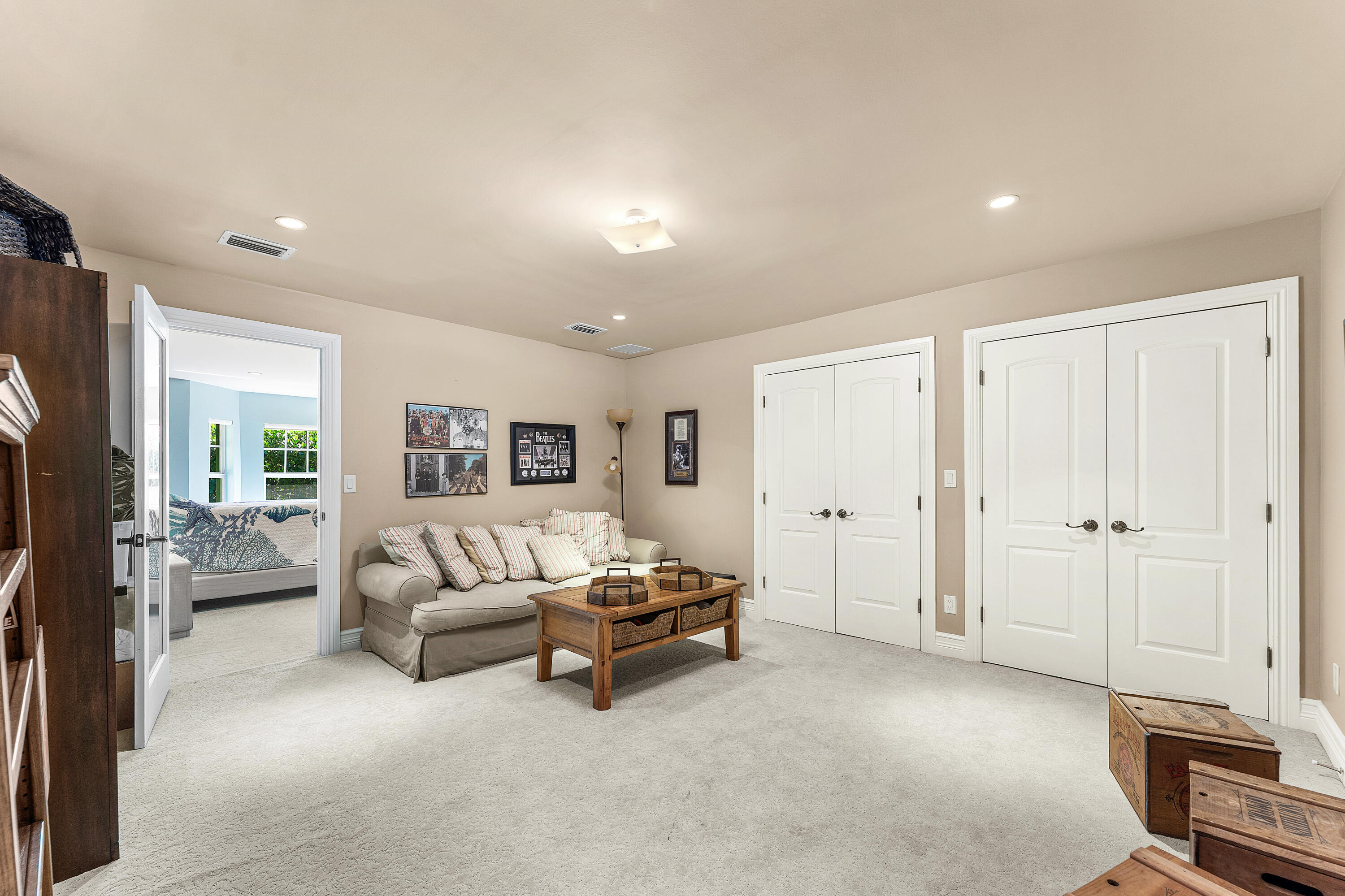 10295 St Andrews Road Boynton Beach, FL 33436 - Photo 30 of 43 a living room with furniture and a flat screen tv