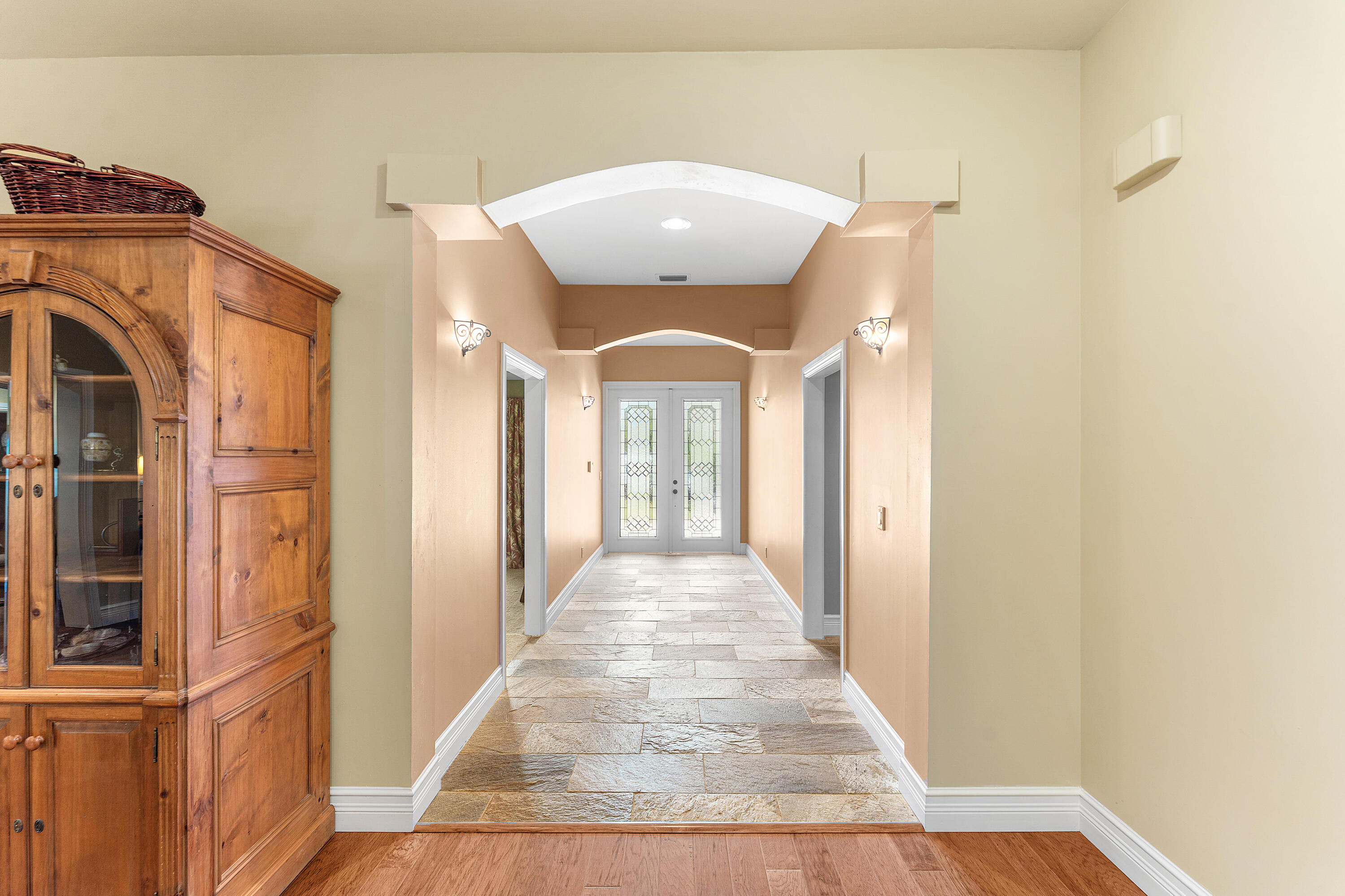 10295 St Andrews Road Boynton Beach, FL 33436 - Photo 3 of 43 a view of a hallway with wooden floor and staircase