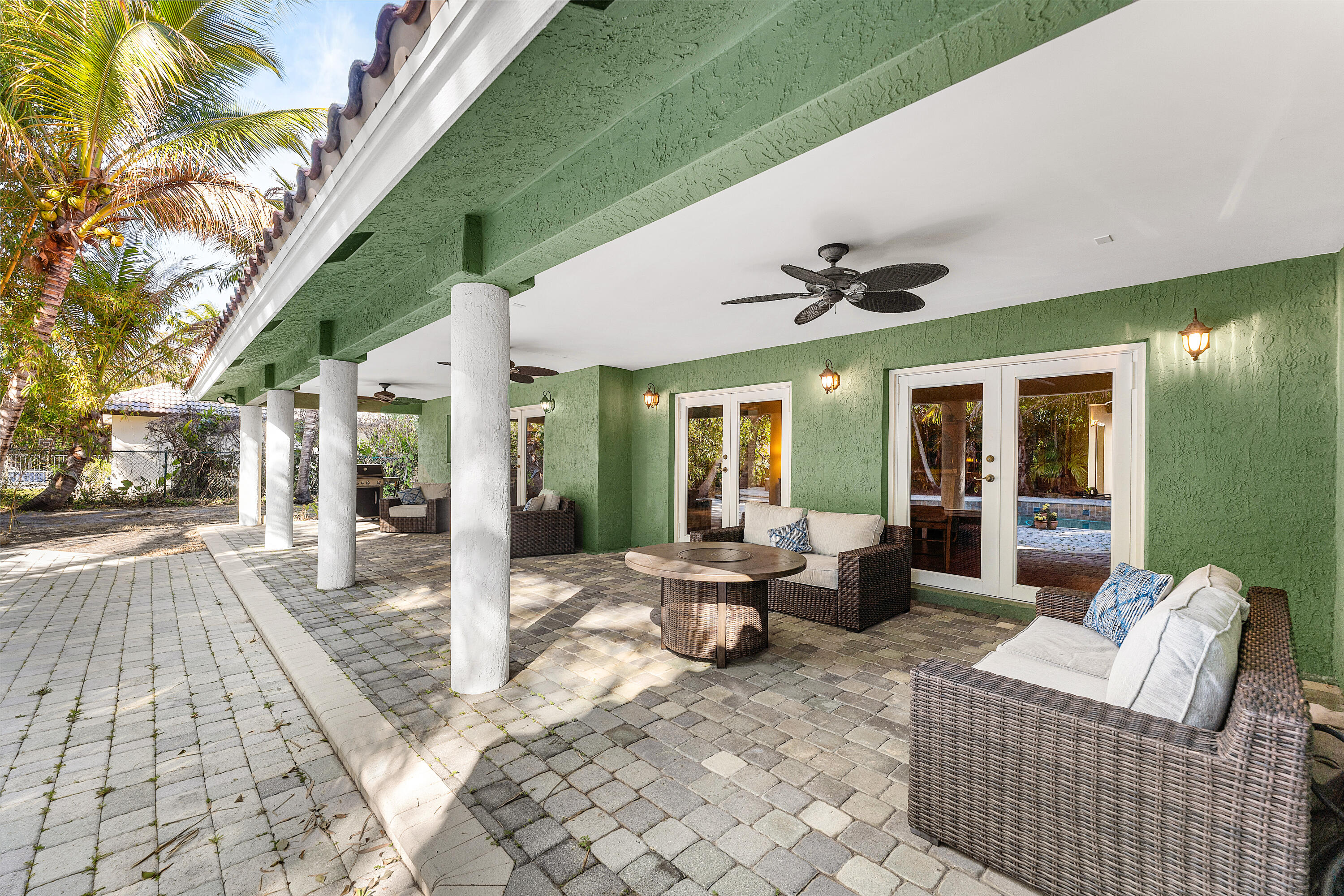 10295 St Andrews Road Boynton Beach, FL 33436 - Photo 33 of 43 a building outdoor space with patio furniture