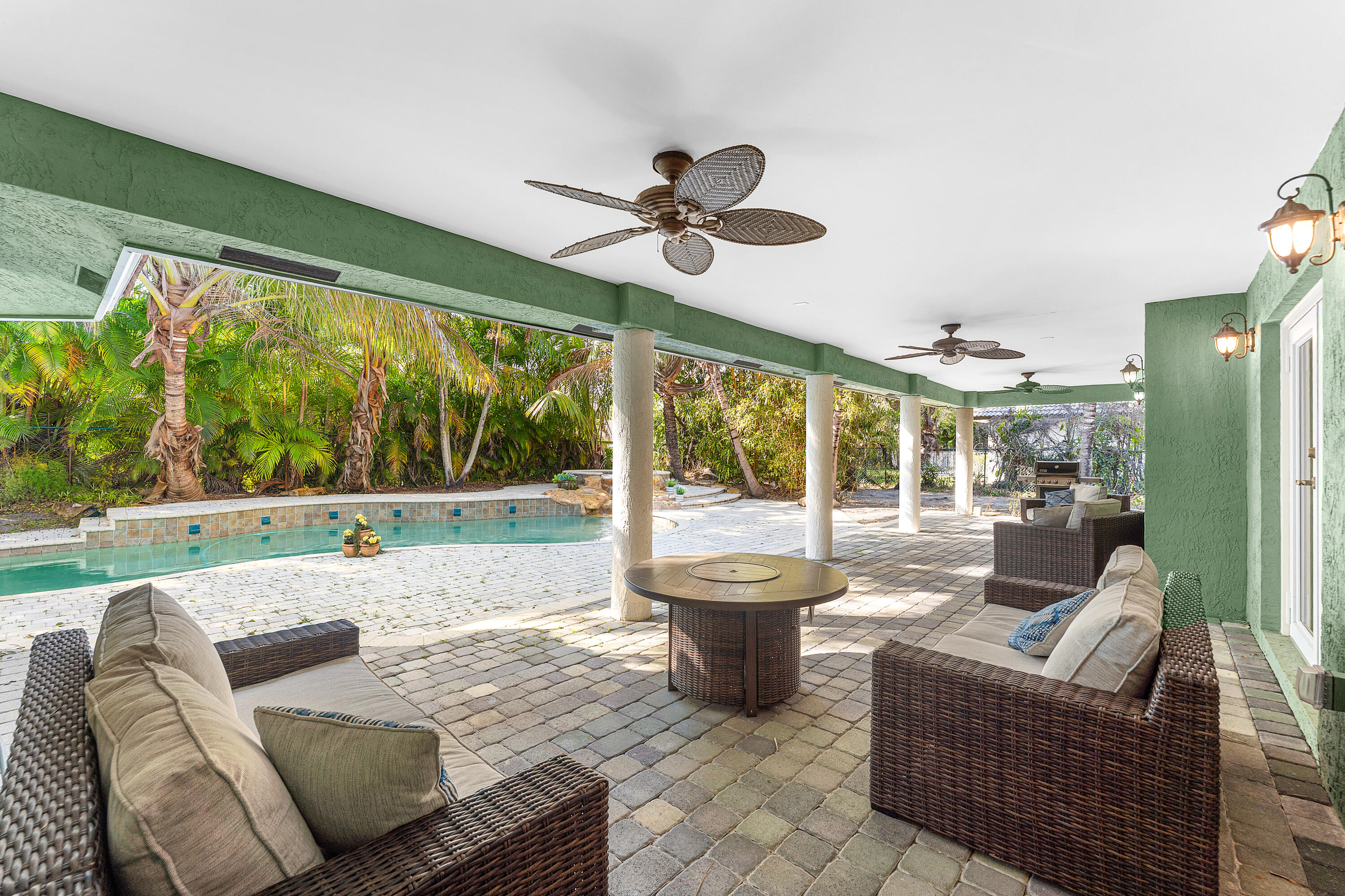 10295 St Andrews Road Boynton Beach, FL 33436 - Photo 34 of 43 a living room with furniture and a large window