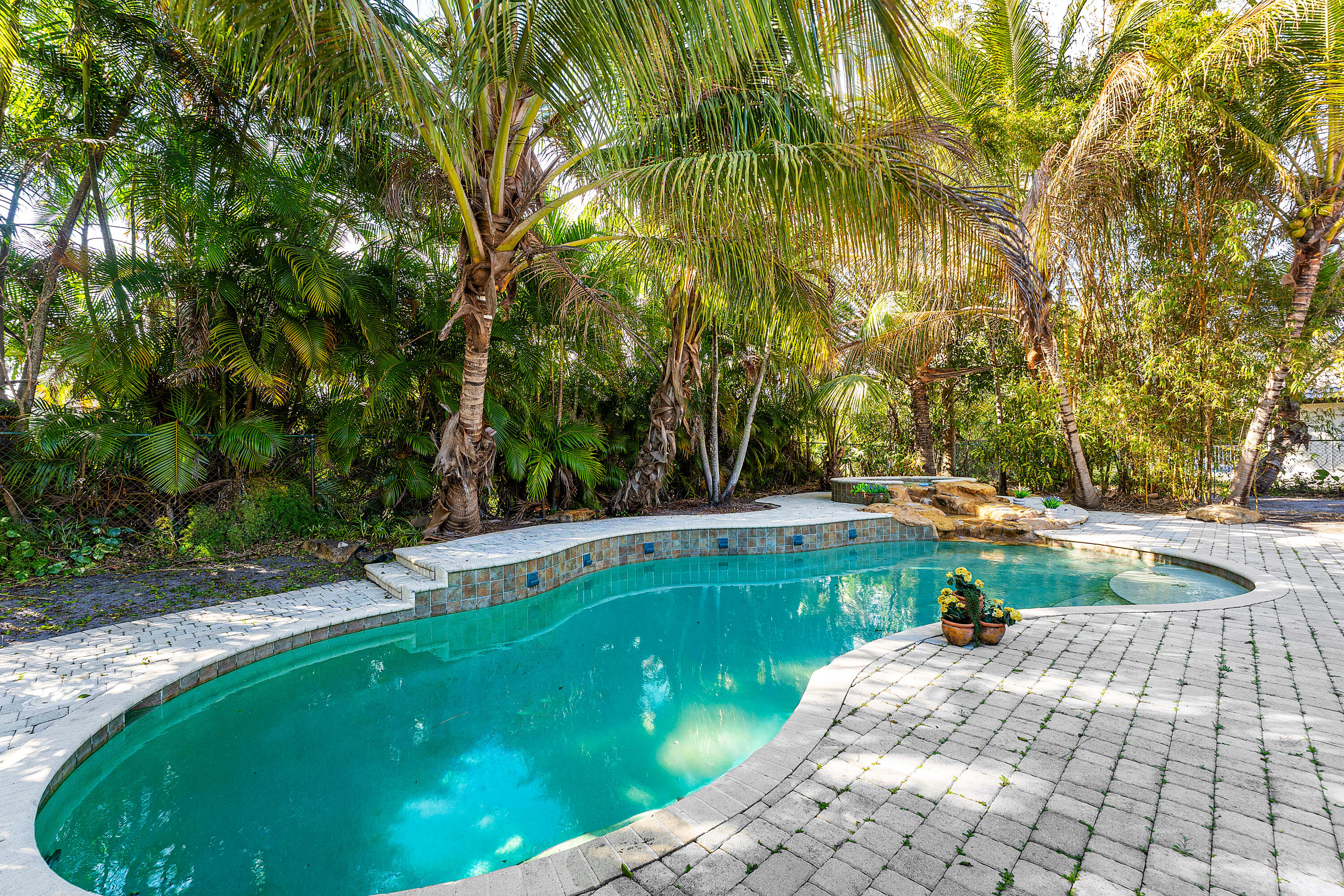 10295 St Andrews Road Boynton Beach, FL 33436 - Photo 36 of 43 a view of yard with swimming pool and trees in the background