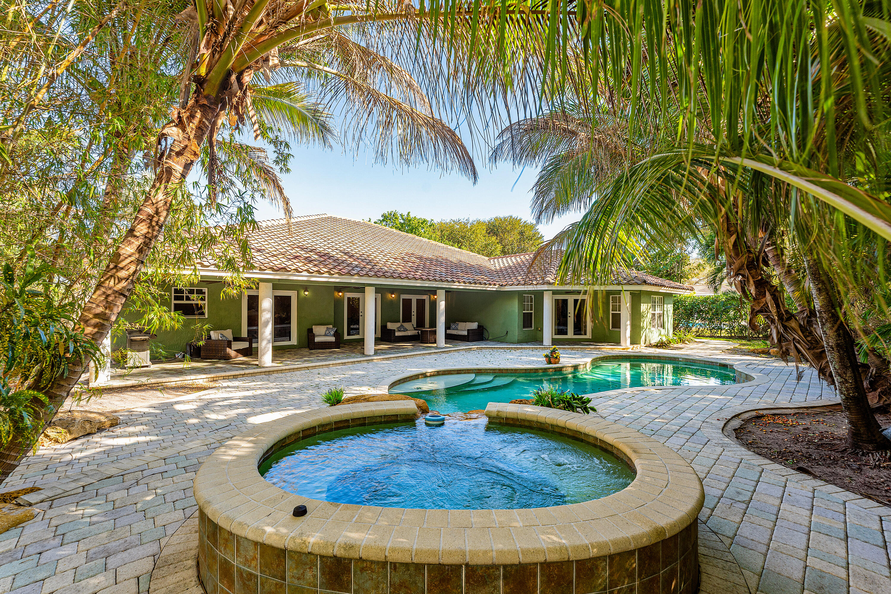 10295 St Andrews Road Boynton Beach, FL 33436 - Photo 40 of 43 a view of a house with pool fire pit and chairs