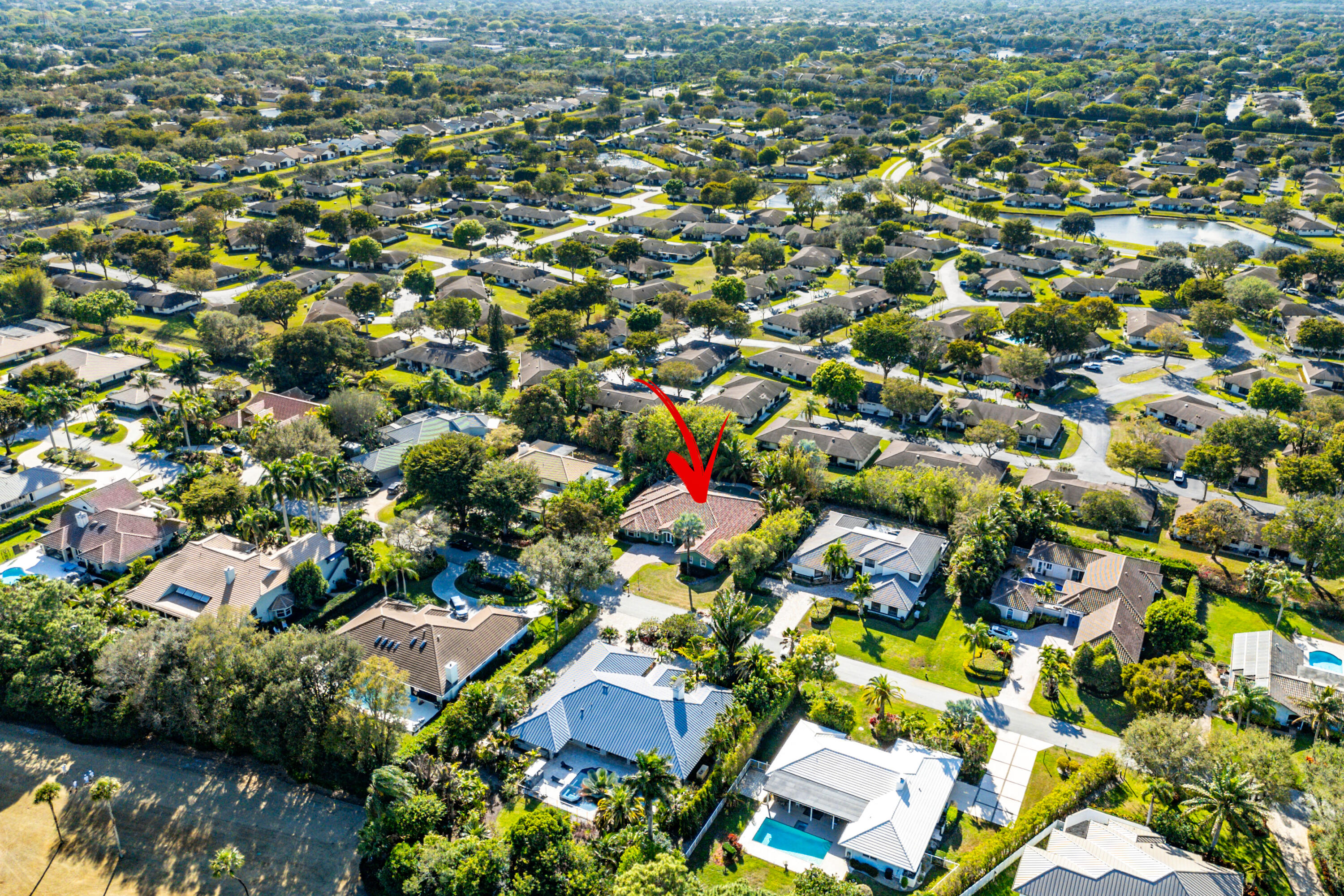 10295 St Andrews Road Boynton Beach, FL 33436 - Photo 42 of 43 an aerial view of residential houses with outdoor space and trees