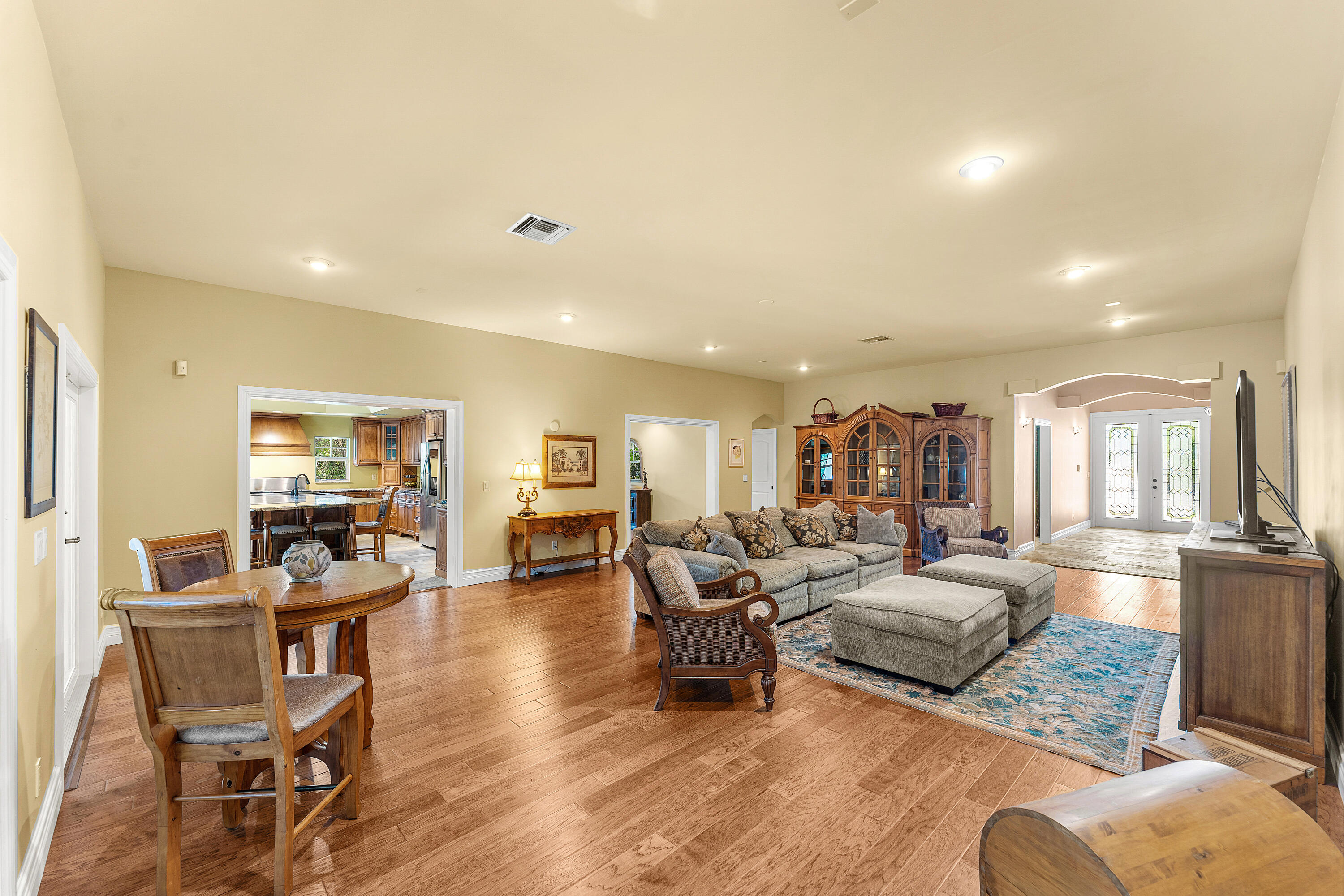 10295 St Andrews Road Boynton Beach, FL 33436 - Photo 6 of 43 a living room with furniture and a wooden floor
