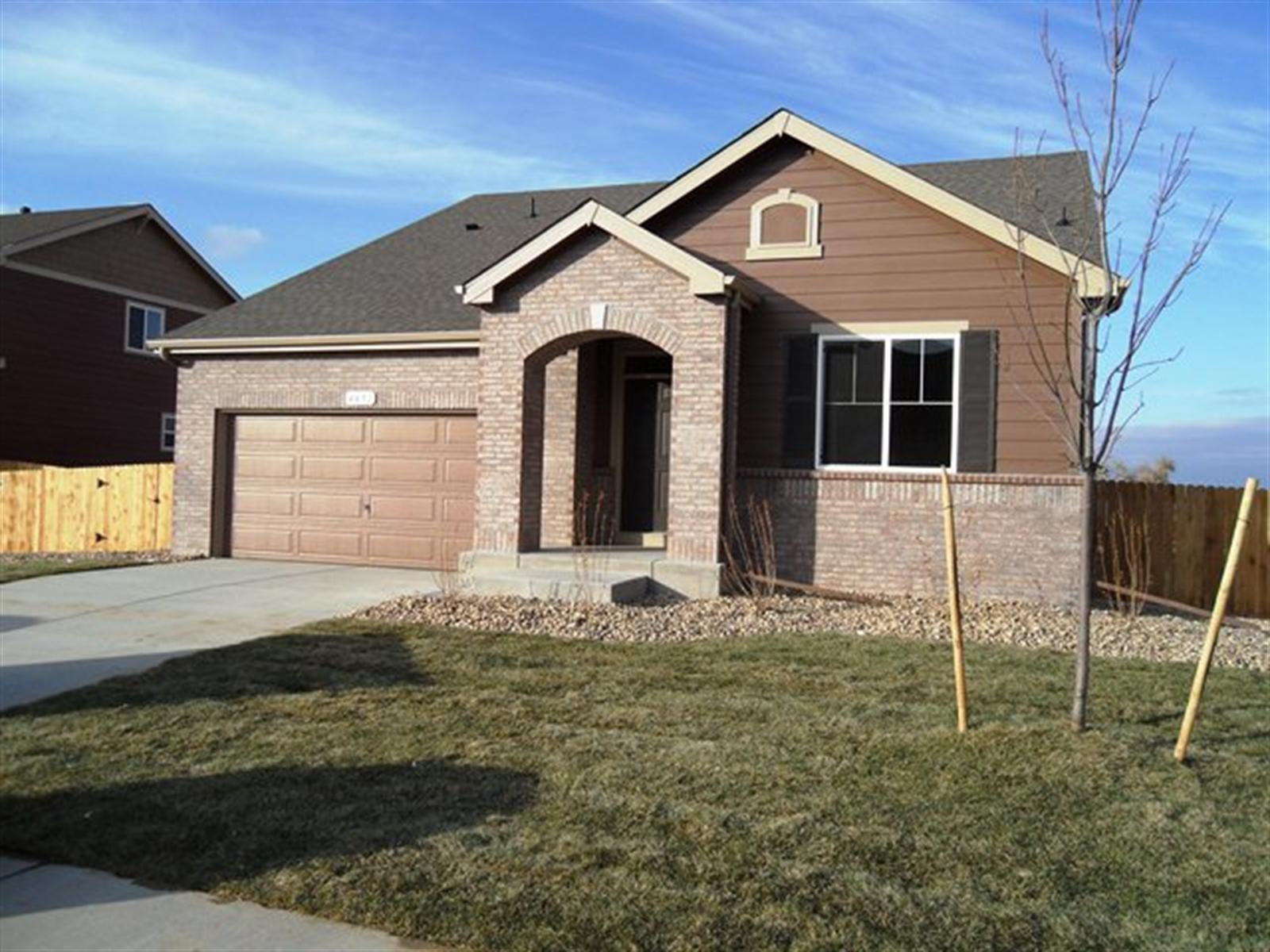 4491 Bramble Road Frederick, CO 80504 - Photo 1 of 1 a front view of a house with a yard