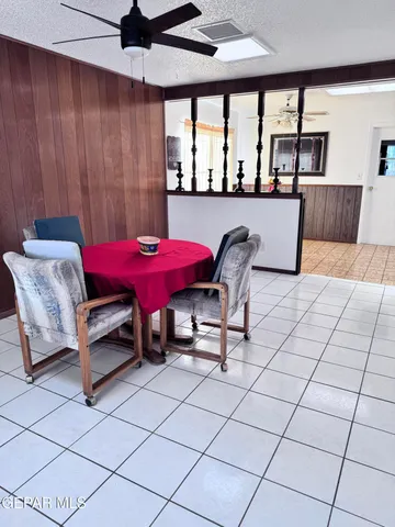 a kitchen with a sink a counter top space stainless steel appliances and cabinets