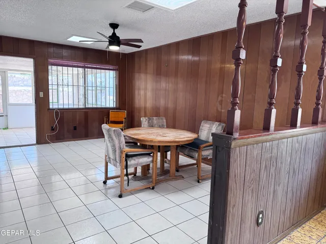 a view of a dining room with furniture and window