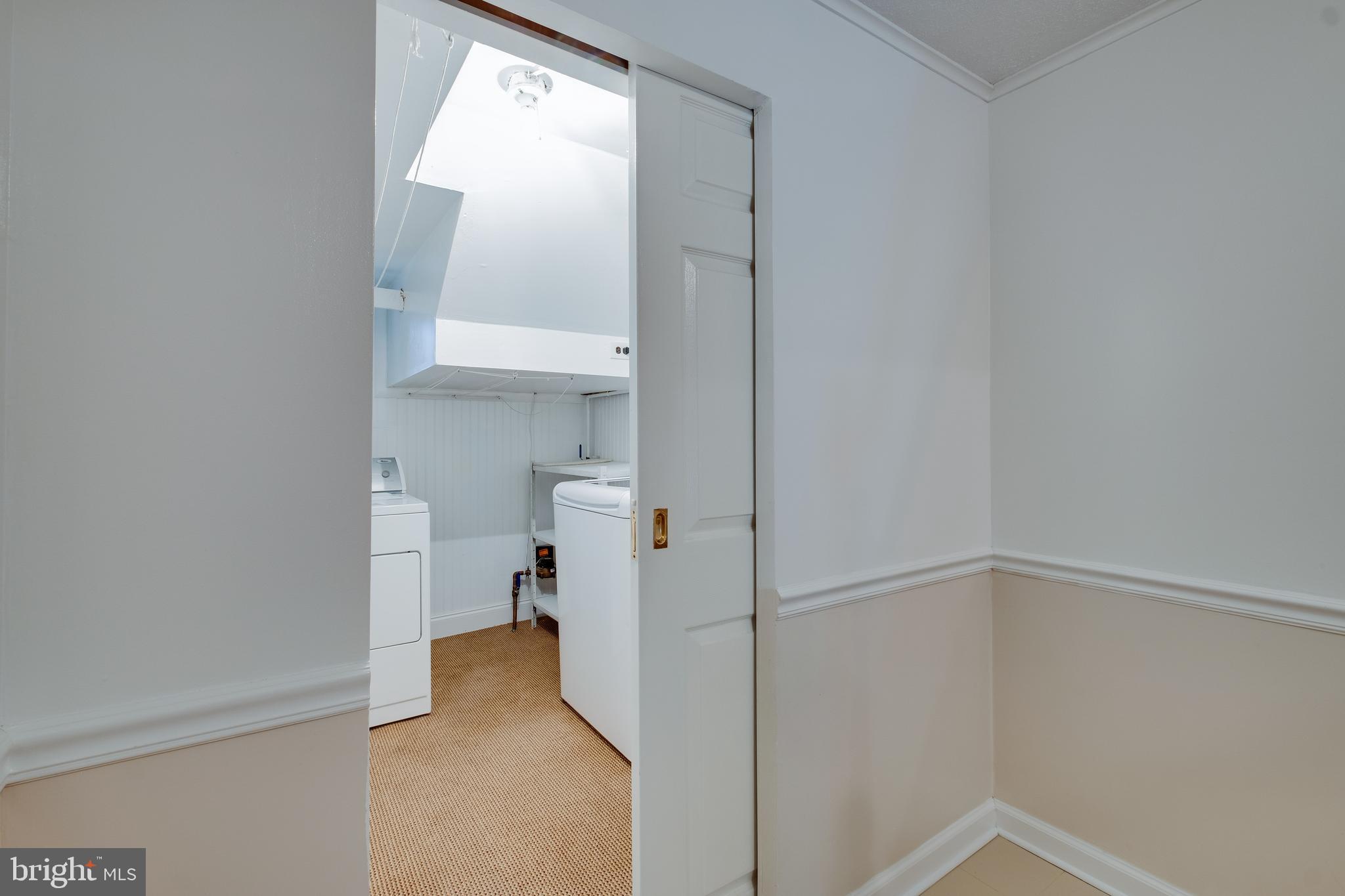 10729 Philcrest Road Philadelphia, PA 19154 - Photo 19 of 32 Pocket door hides laundry area