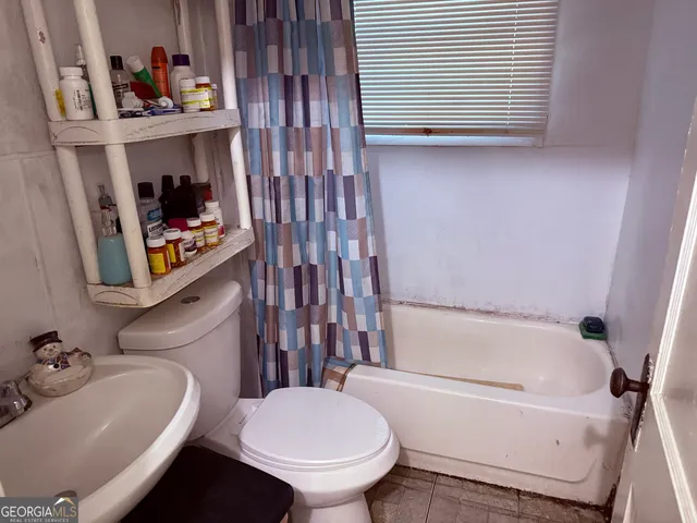 a bathroom with a sink and a toilet