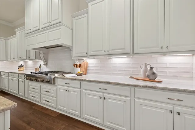 a dining room with furniture potted plants and wooden floor