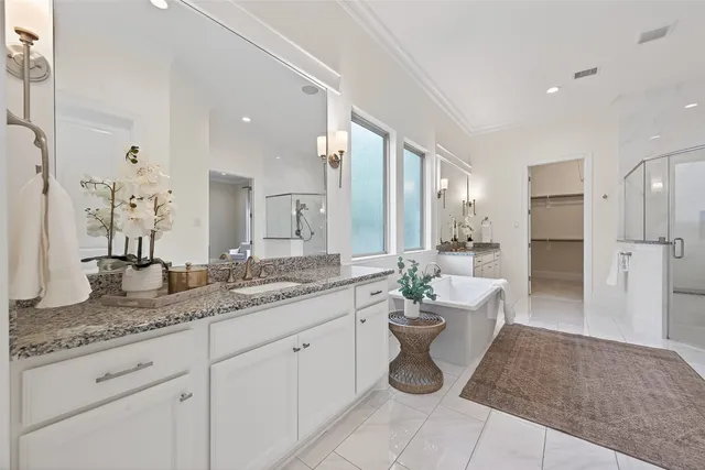 a view of a house with a yard and sitting area