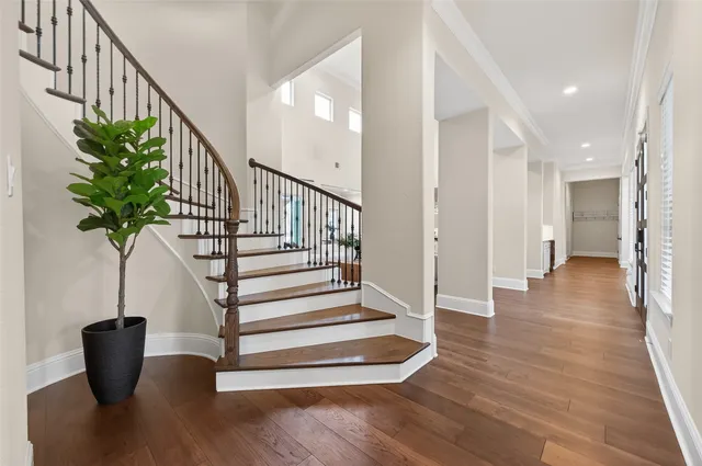 a bedroom with a bed and a television