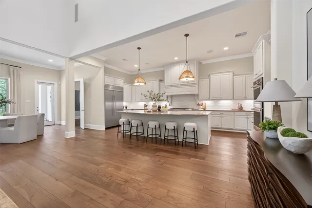 a kitchen with granite countertop a sink and cabinets