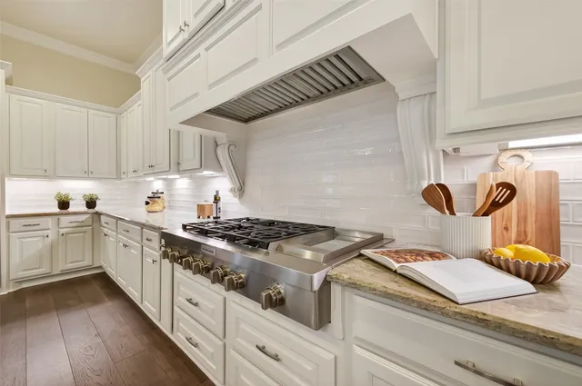 a bathroom with a white tub shower and double vanity
