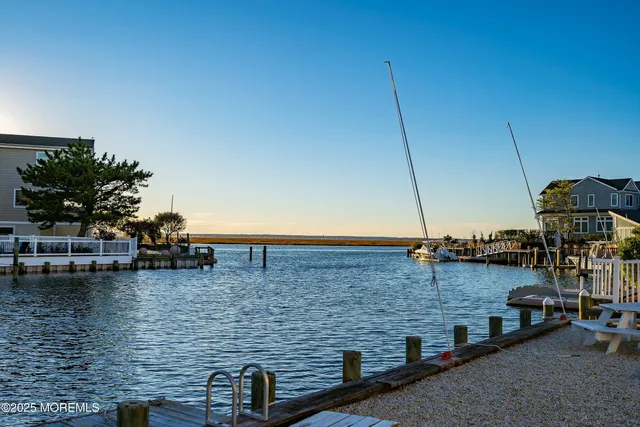 an aerial view of a houses with a swimming pool