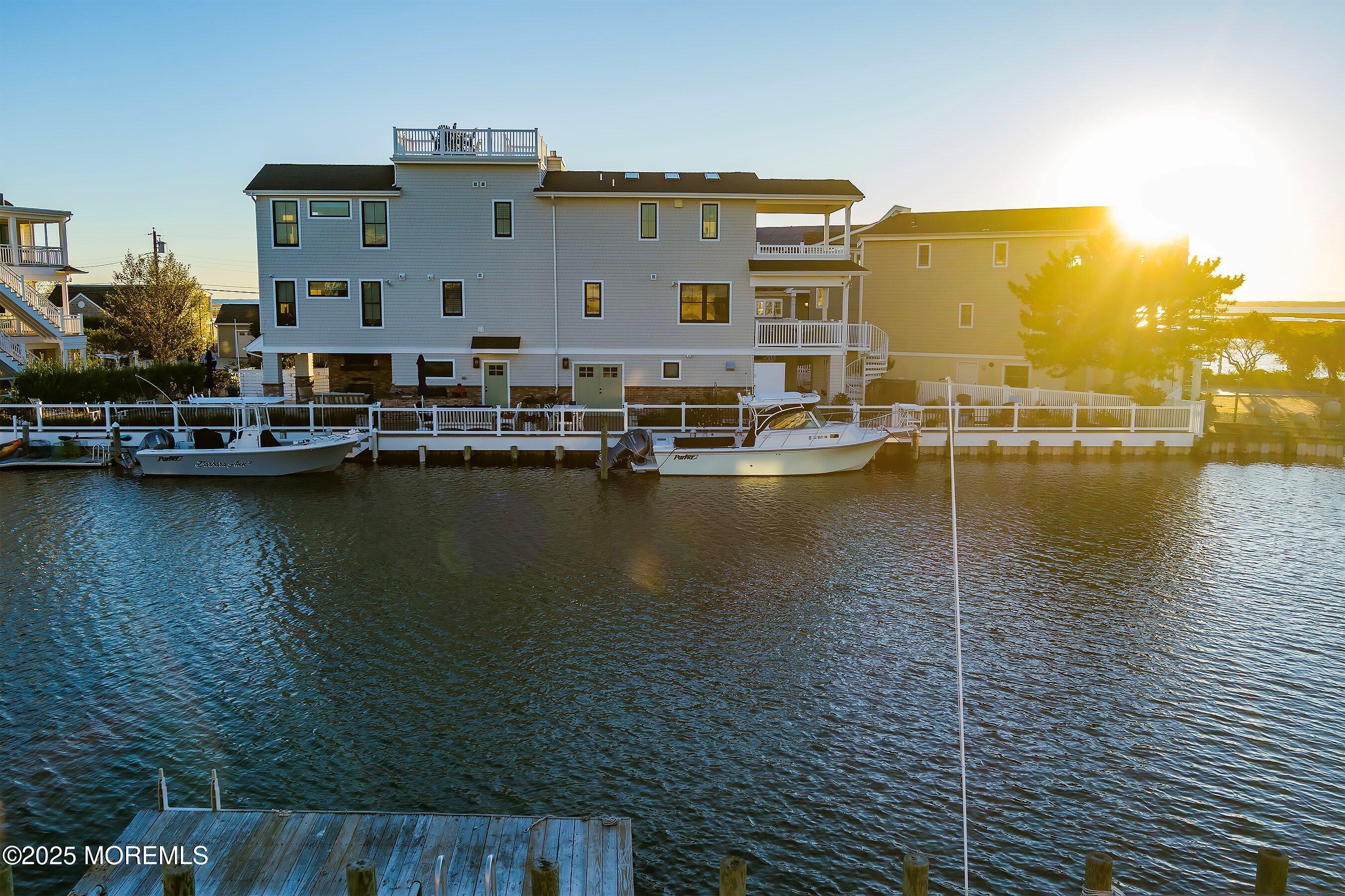 46 Adrian Road Barnegat Light, NJ 08006 - Photo 17 of 28 a view of a lake with houses