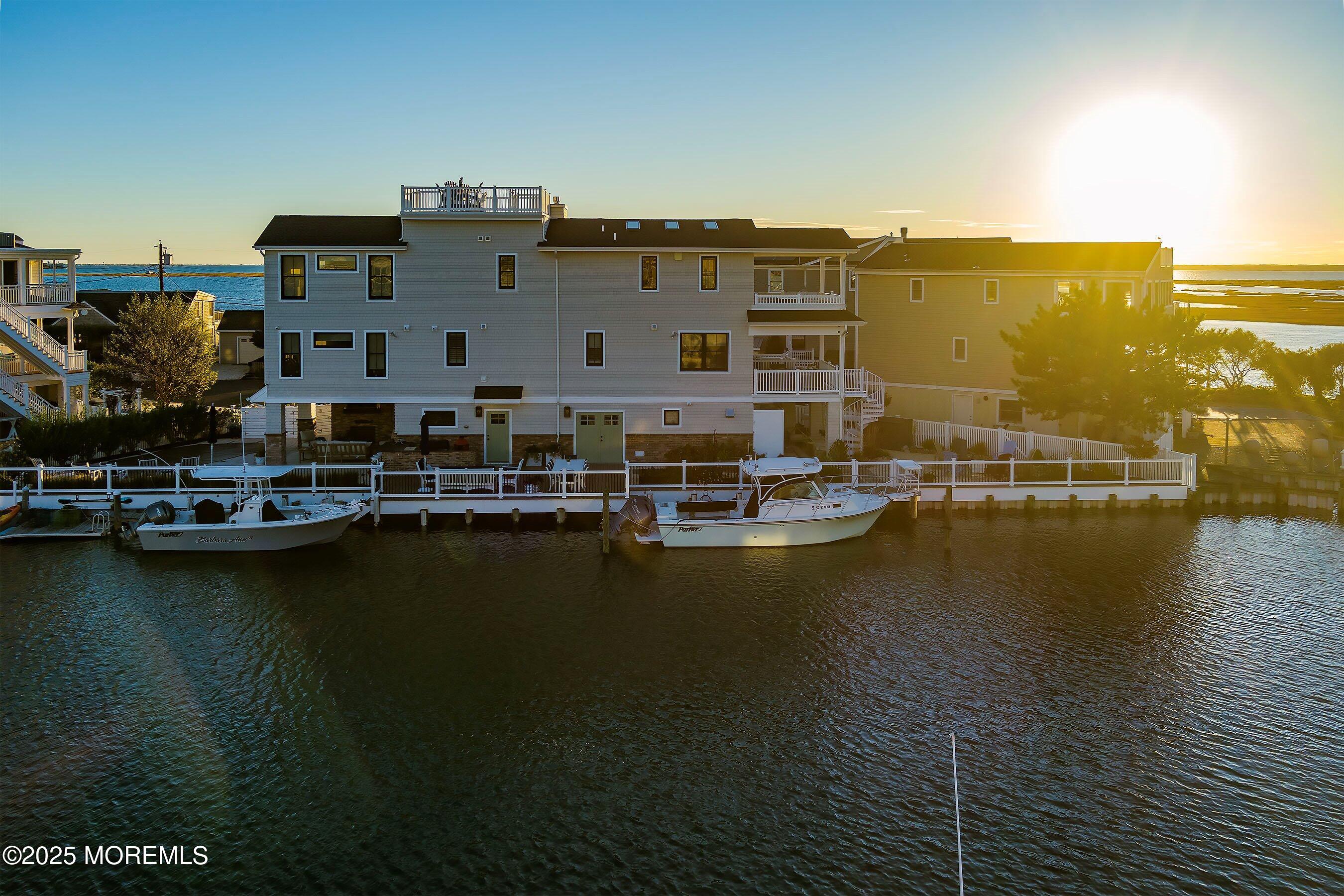 46 Adrian Road Barnegat Light, NJ 08006 - Photo 20 of 28 a view of a lake with boats and trees