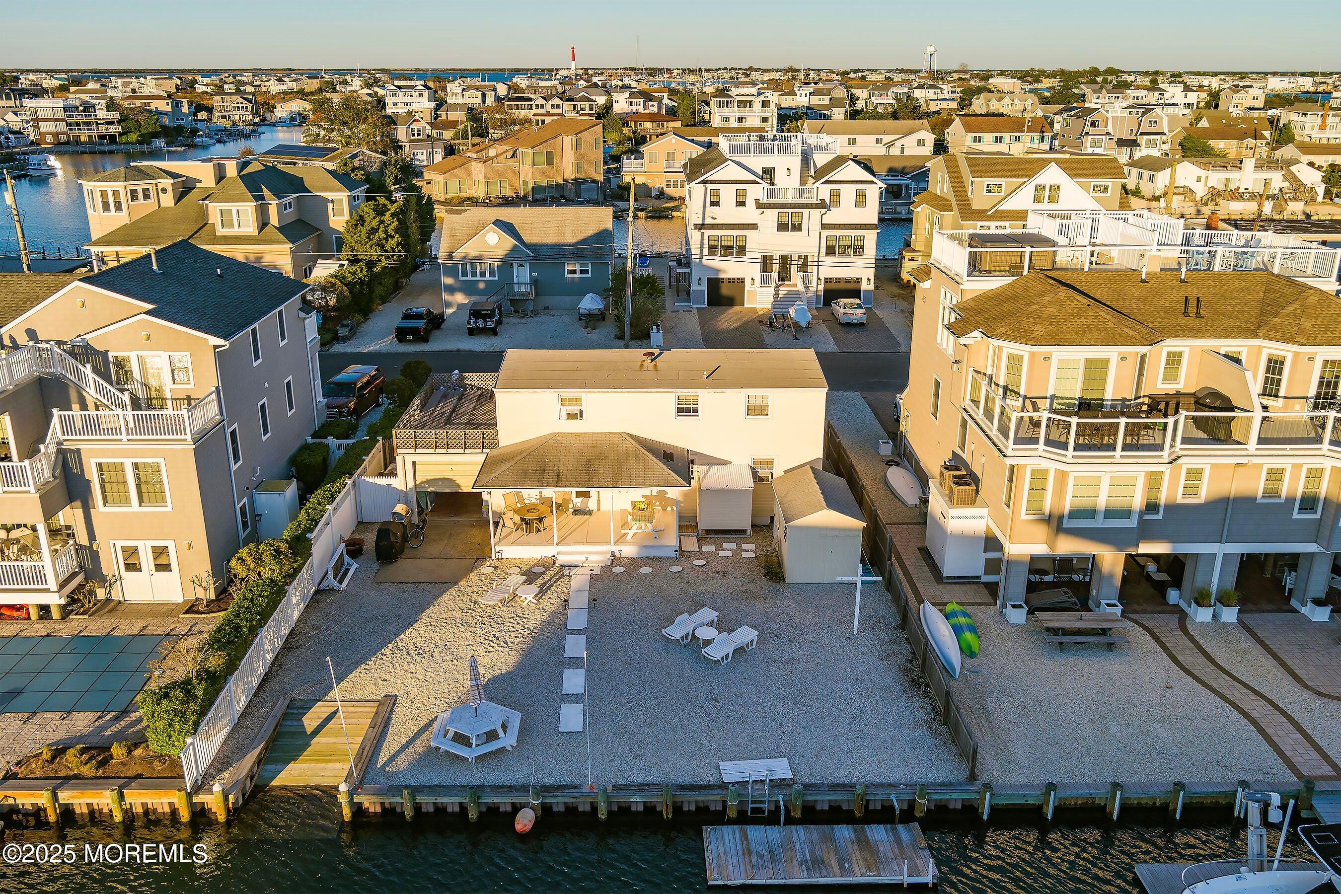 46 Adrian Road Barnegat Light, NJ 08006 - Photo 3 of 28 an aerial view of residential houses with outdoor space