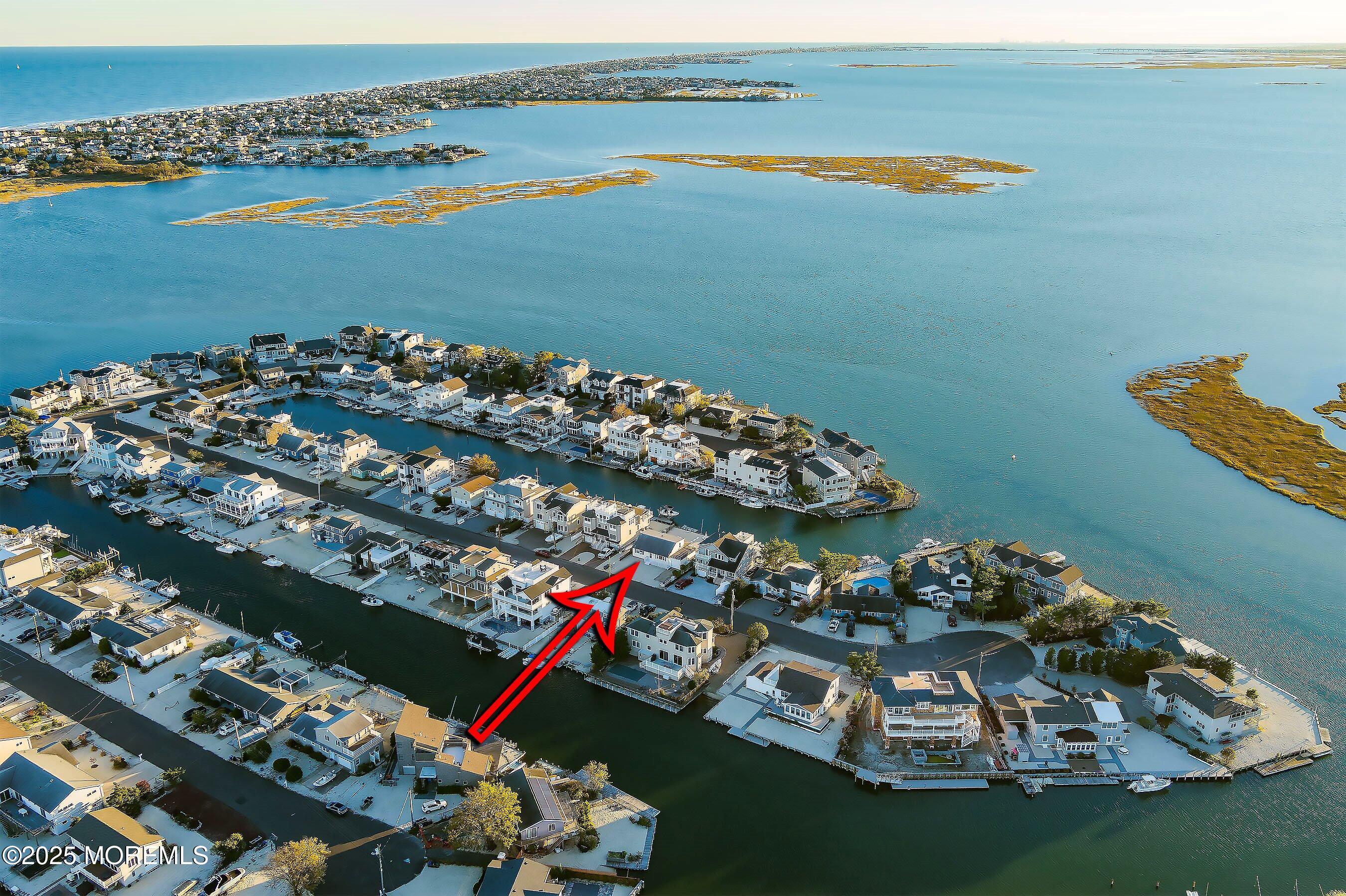 46 Adrian Road Barnegat Light, NJ 08006 - Photo 10 of 28 an aerial view of a houses with a lake