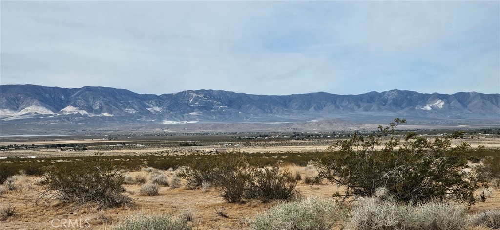 a view of a lake with mountains in the background