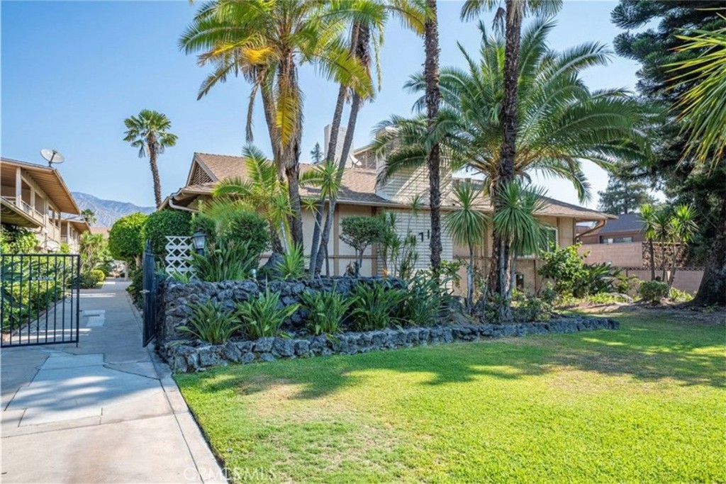 471 West Duarte Road, Unit 216 Arcadia, CA 91007 - Photo 17 of 18 a front view of a house with swimming pool and garden