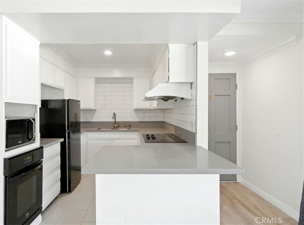 471 West Duarte Road, Unit 216 Arcadia, CA 91007 - Photo 5 of 18 a kitchen with stainless steel appliances a refrigerator a sink and a stove