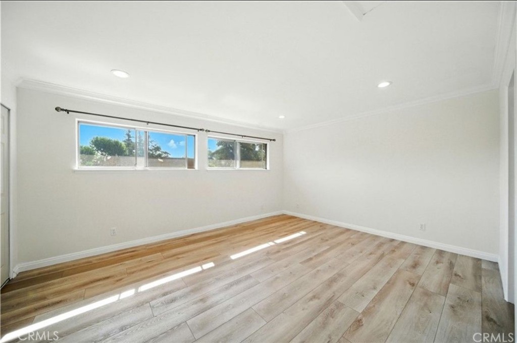 471 West Duarte Road, Unit 216 Arcadia, CA 91007 - Photo 8 of 18 a view of empty room with wooden floor and fan