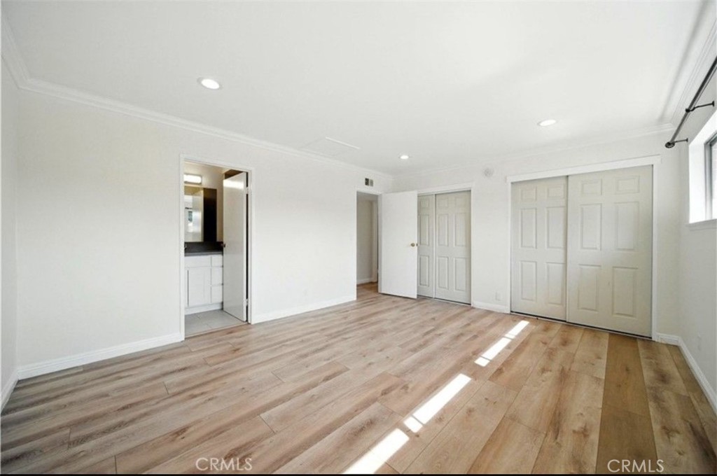 471 West Duarte Road, Unit 216 Arcadia, CA 91007 - Photo 9 of 18 a view of an empty room with wooden floor