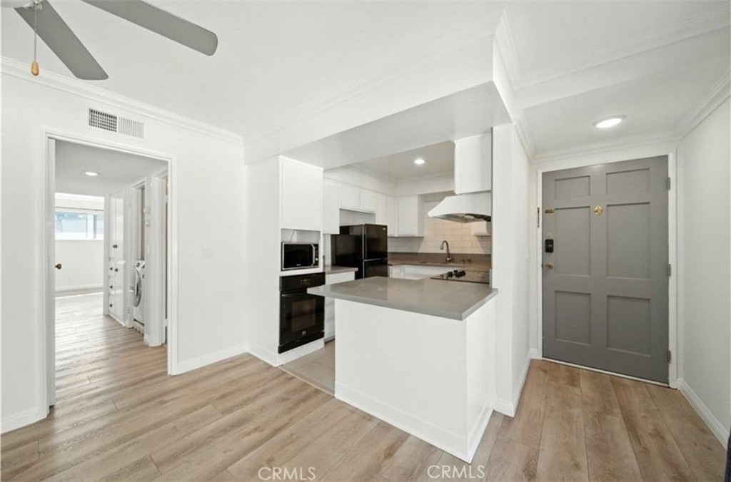 471 West Duarte Road, Unit 216 Arcadia, CA 91007 - Photo 10 of 18 a kitchen with a refrigerator a sink and a microwave