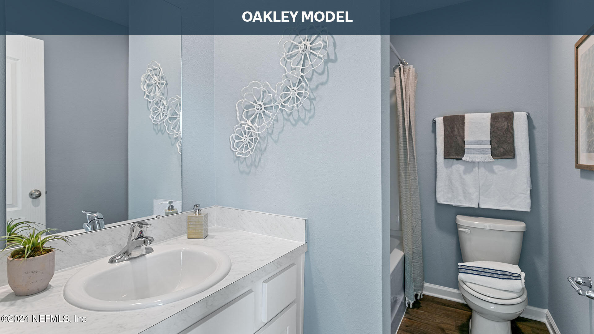 9249 Stony Brook Road Jacksonville, FL 32256 - Photo 17 of 34 a bathroom with a toilet sink and mirror