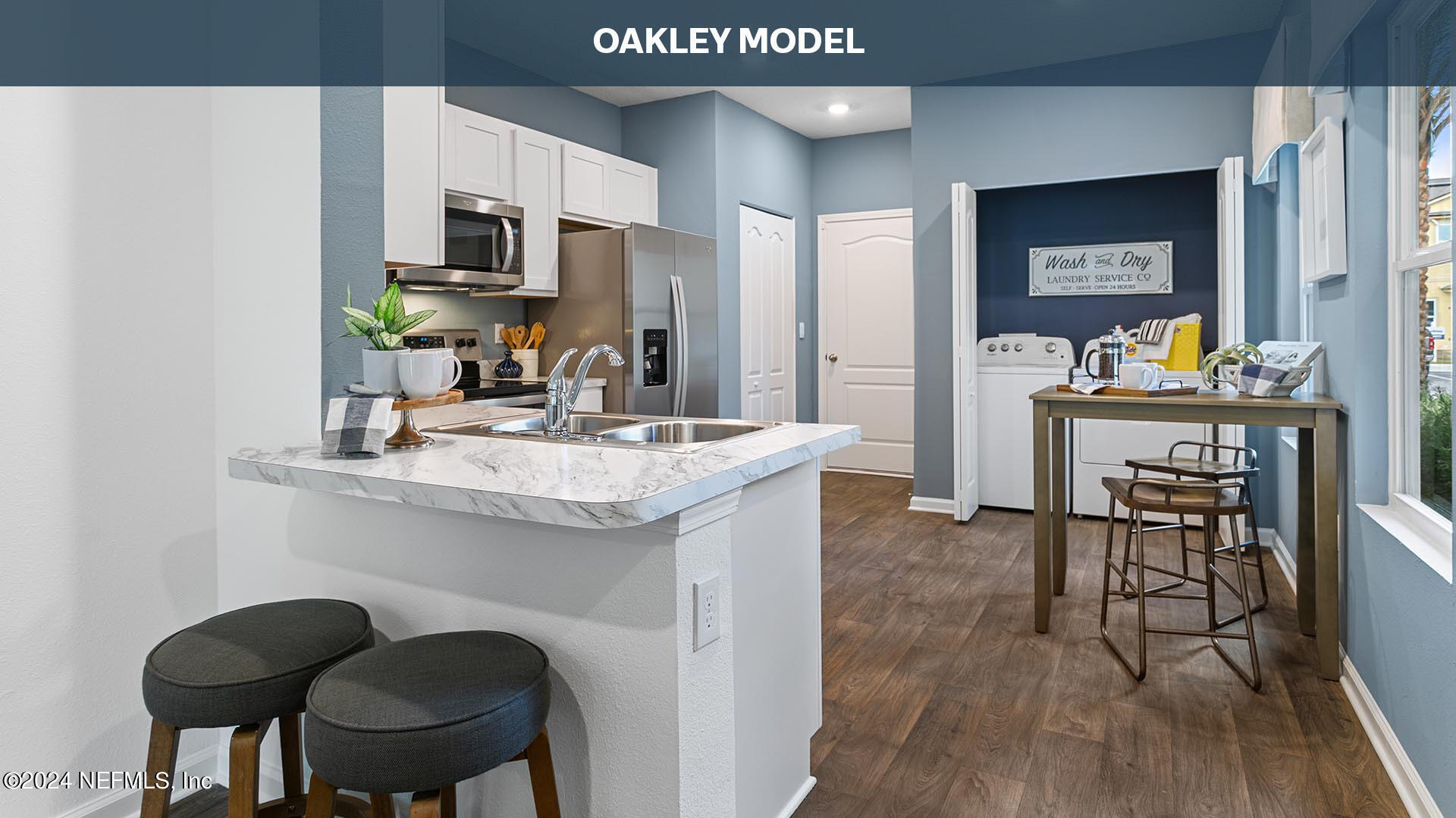 9249 Stony Brook Road Jacksonville, FL 32256 - Photo 6 of 34 a kitchen with kitchen island granite countertop a sink cabinets and wooden floor
