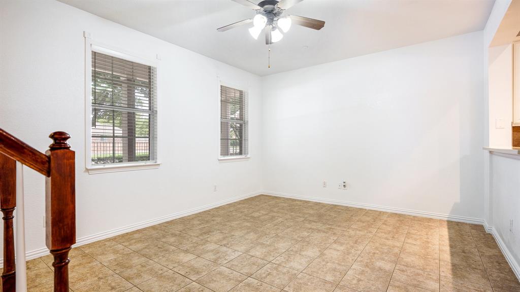 3206 Bedford Road Bedford, TX 76021 - Photo 7 of 26 a view of a room with a ceiling fan and window
