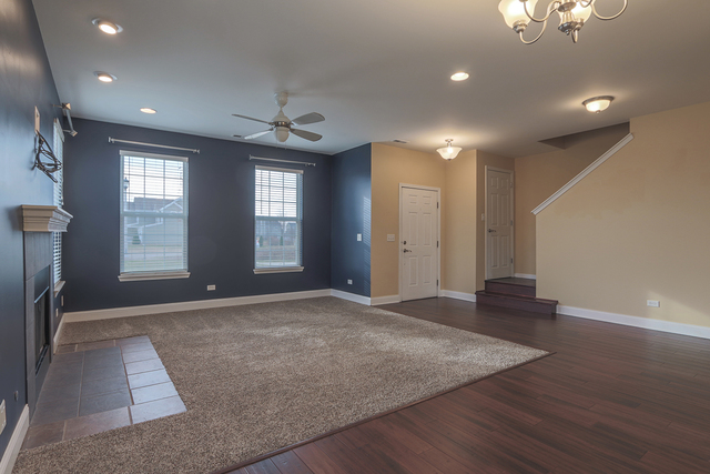 1240 Mariemont Road, Unit E Sugar Grove, IL 60554 - Photo 11 of 32 an empty room with windows and closet