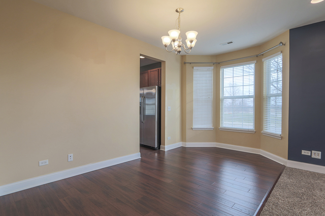 1240 Mariemont Road, Unit E Sugar Grove, IL 60554 - Photo 12 of 32 a view of livingroom with window