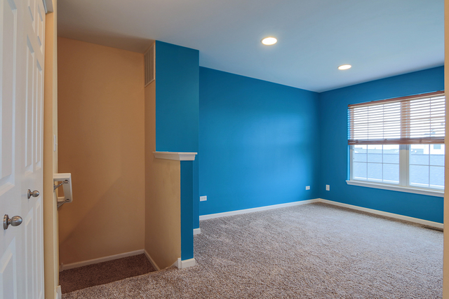 1240 Mariemont Road, Unit E Sugar Grove, IL 60554 - Photo 22 of 32 a view of an empty room with a window