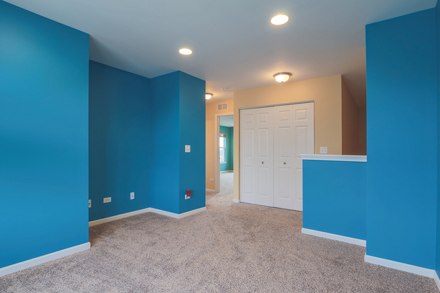 1240 Mariemont Road, Unit E Sugar Grove, IL 60554 - Photo 24 of 32 an empty room with closet and a bathroom
