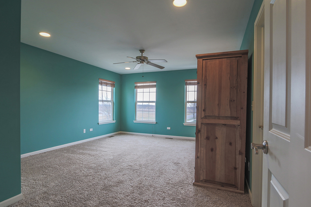 1240 Mariemont Road, Unit E Sugar Grove, IL 60554 - Photo 25 of 32 a view of empty room with window and fireplace