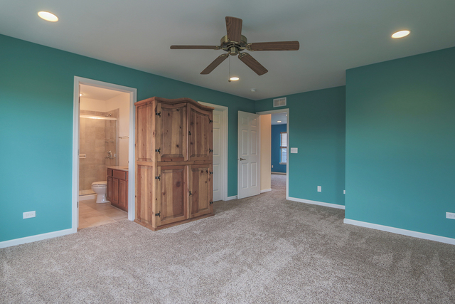 1240 Mariemont Road, Unit E Sugar Grove, IL 60554 - Photo 27 of 32 an empty room with closet and a ceiling fan