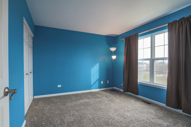 1240 Mariemont Road, Unit E Sugar Grove, IL 60554 - Photo 30 of 32 a view of an empty room with a window