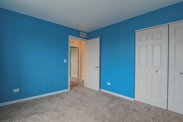 1240 Mariemont Road, Unit E Sugar Grove, IL 60554 - Photo 31 of 32 an empty room with closet area