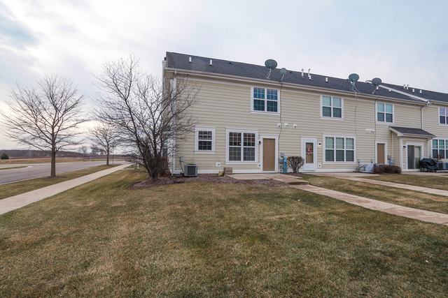 1240 Mariemont Road, Unit E Sugar Grove, IL 60554 - Photo 5 of 32 a view of a house with a snow in the yard