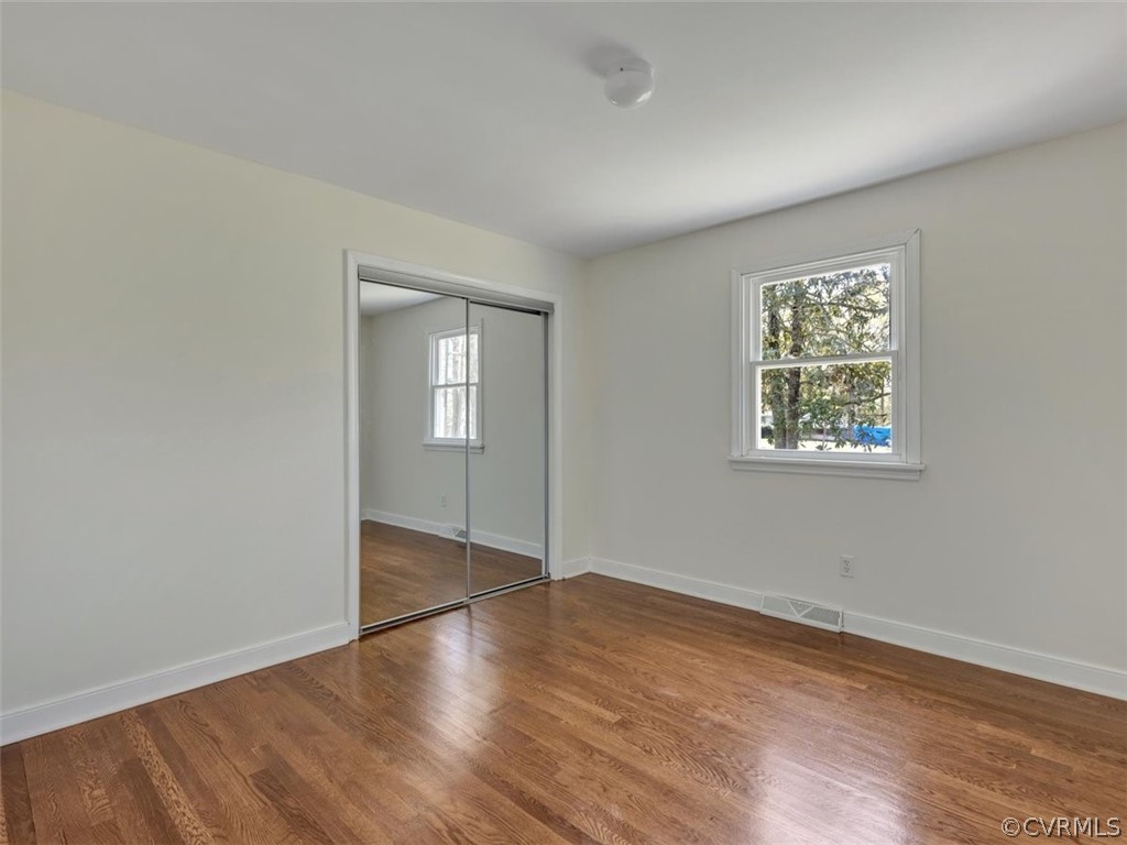 5331 Carteret Road Chesterfield, VA 23832 - Photo 14 of 27 an empty room with wooden floor and windows