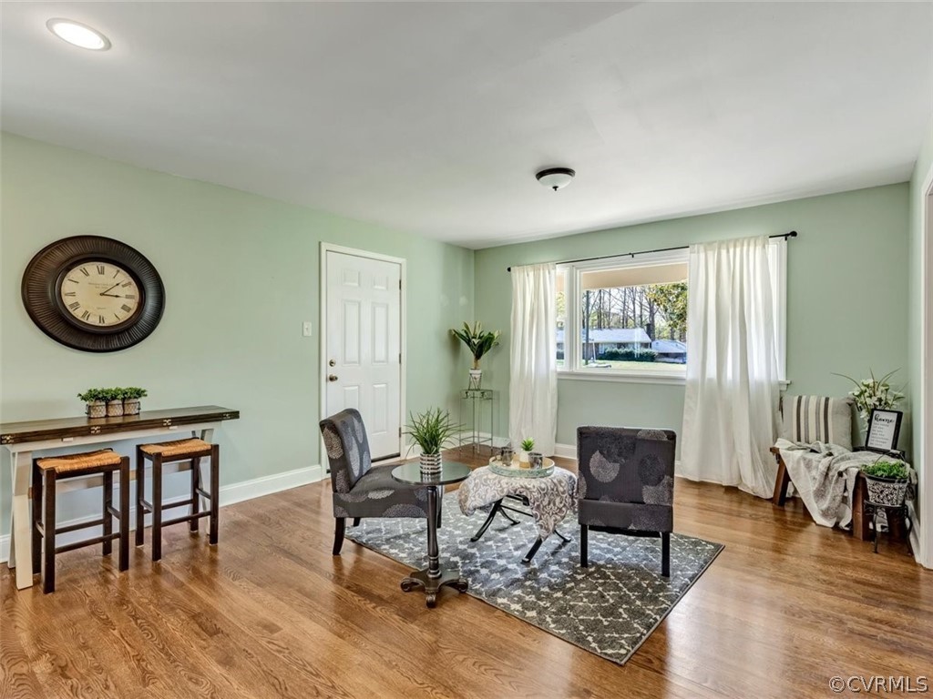 5331 Carteret Road Chesterfield, VA 23832 - Photo 4 of 27 a living room with furniture a clock on wall and a window