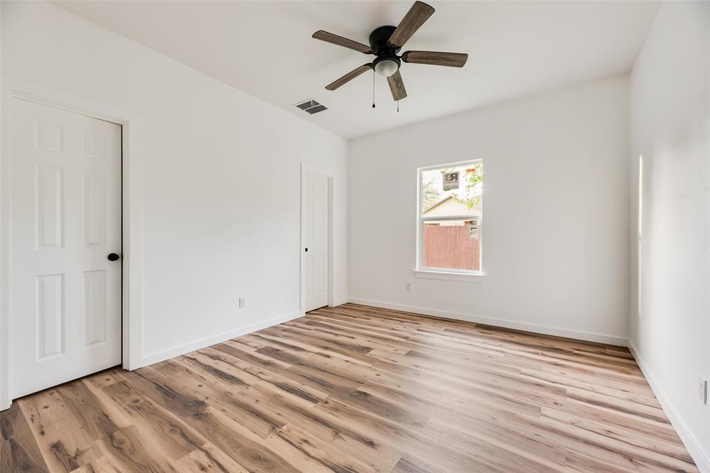 1014 Trinity Street Cleburne, TX 76031 - Photo 16 of 24 a view of empty room with wooden floor