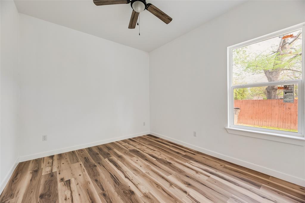 1014 Trinity Street Cleburne, TX 76031 - Photo 17 of 24 a view of a room with a window
