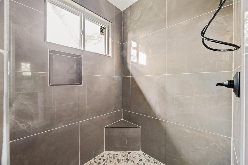1014 Trinity Street Cleburne, TX 76031 - Photo 18 of 24 a bathroom with a shower