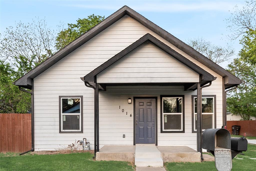 1014 Trinity Street Cleburne, TX 76031 - Photo 2 of 24 a front view of a house with garden