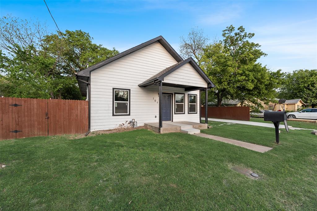 1014 Trinity Street Cleburne, TX 76031 - Photo 4 of 24 a view of a house with a yard
