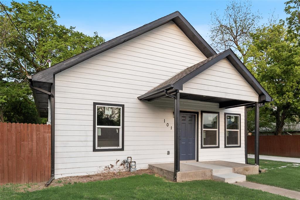 1014 Trinity Street Cleburne, TX 76031 - Photo 5 of 24 a front view of a house with a yard and porch